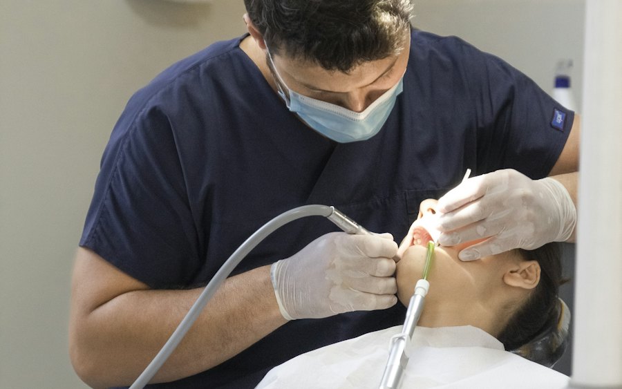 A dental specialist treating a patient