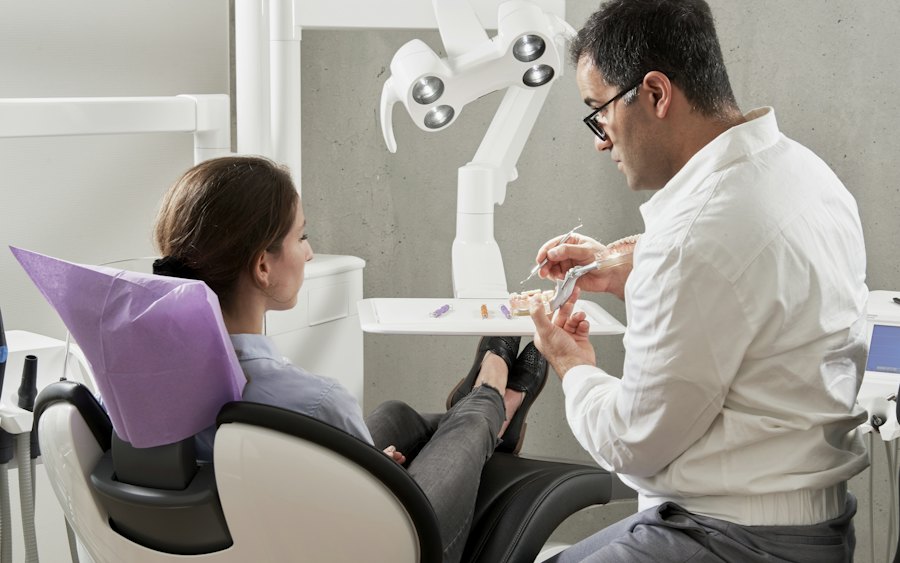 A dentist discussing treatment with a patient